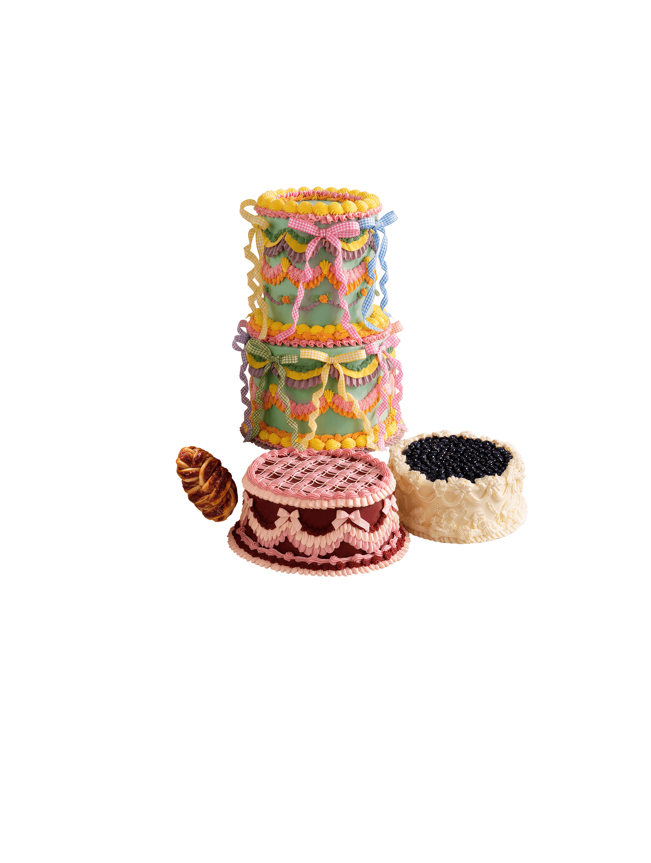 A table of celebration cakes, pastries and flowers under a pink sky
